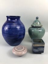 Studio Art Pottery, four items of studio pottery being a green glazed stone ware lidded pot, a