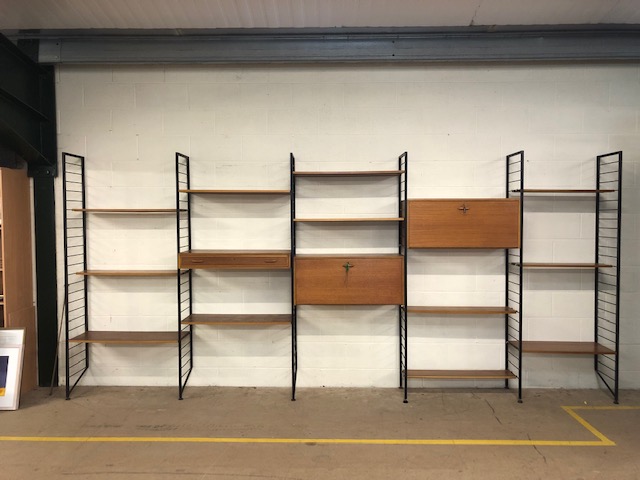 Large installation of mid century teak and metal Ladderax, consisting of five bays and various