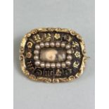 Victorian Mourning brooch in Gold metal with rectangular seed pearl frame to Locket of hair. Gold