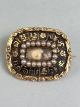 Victorian Mourning brooch in Gold metal with rectangular seed pearl frame to Locket of hair. Gold