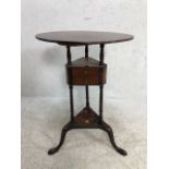 Circular tripod occasional table with floating triangular shaped pair of drawers all on Queen Ann