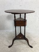 Circular tripod occasional table with floating triangular shaped pair of drawers all on Queen Ann