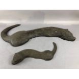 Otter sculpture, pair of cold cast naturalistic sculptures of a swimming otter and its kit the