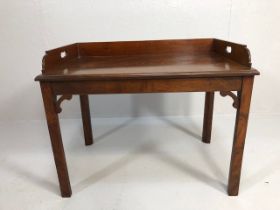 Antique furniture, a reproduction of an early19th century galleried butlers side table in flame