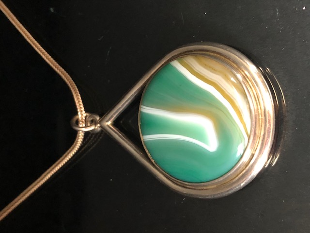 Silver hallmarked pendant inlaid with green banded agate on chain approximately 30.86g