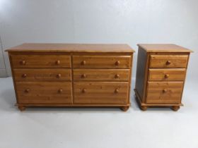 Modern pine furniture, low double chest of drawers on turned feet, run of 3 drawers each side,