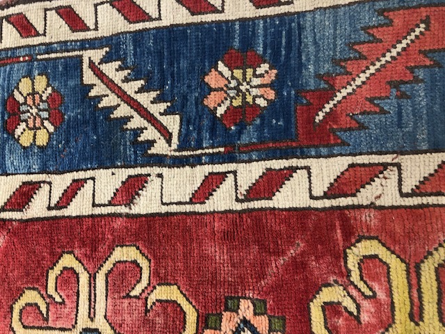 Oriental Rug, Konya wool rug with typical geometric patterns on red back ground with blue border - Image 6 of 7