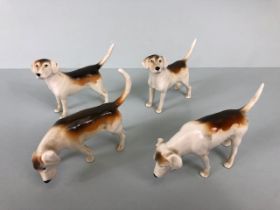 Beswick China, four black stamp fox hounds the undersides stamped Beswick England (approximately 7cm