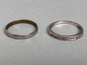 Unmarked half eternity ring (white gold?) set with diamond chips and a platinum band total weight