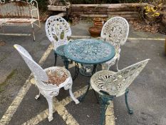 Metal bistro table with four chairs