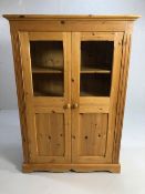 Pine furniture, modern hall cupboard with 3 shelves and 2 half glazed panel doors, approximately