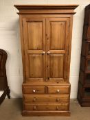 Pine furniture, modern pine linen press style wardrobe with double doors, seated on chest of drawers