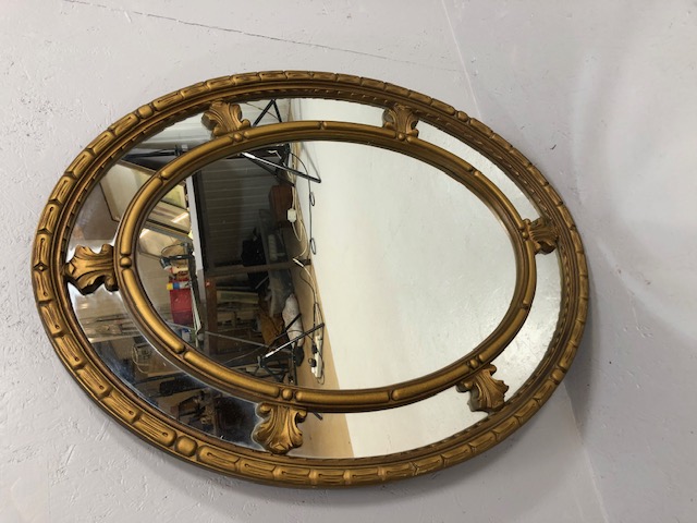 Mirror, Modern Regency style oval wall mirror, in sectional galleried guilt frame, approximately