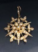 Victorian unmarked gold metal and seed pearl star pendant approximately 2.62g