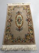 Modern Chinese style wool sculpted rug with designs of flowers predominantly mushroom colored