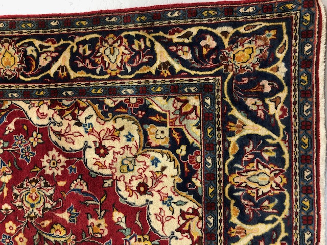 Oriental Rug, Wool rug of Persian design predominantly red background with typical arabesque - Image 2 of 6