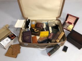 Collection of antique and vintage items contained in a suit case. The proceeds from this lot to be