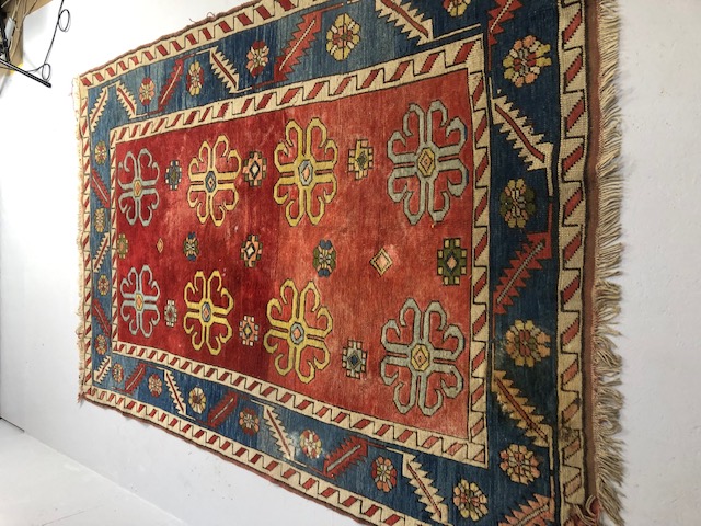 Oriental Rug, Konya wool rug with typical geometric patterns on red back ground with blue border - Image 3 of 7