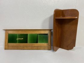 Antique wooden corner shelf an a green tiled splash back from a wash stand