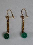 Pair of transparent (Burmese) jade sphere earrings on openwork Gold coloured drop suspension mounted
