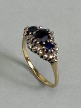 9ct yellow gold hallmarked ring set with three graduated Sapphires and diamonds size approx 'P'
