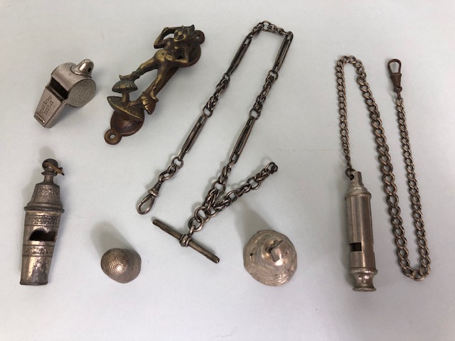 Collection of curios to include a silver hallmarked Albert and chain, railway interest whistles,