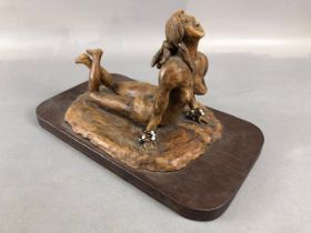 Carved wooden sculpture of a naked woman on a beach signed ADAM'S 08, and inscribed "Sea, Sex &