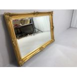 Modern wall mirror in a gilt decorative frame A.F approximately 100 x 72cm