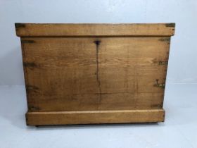 Antique furniture, light Oak plank box trunk on casters with brass reinforcing brackets to corners ,