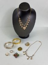 Collection of costume jewellery to include Scottish brooch, Silver and gold coloured bangles, enamel