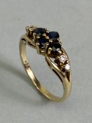 9ct Gold four stone Sapphire ring set with two stones to each shoulder size approx 'M'