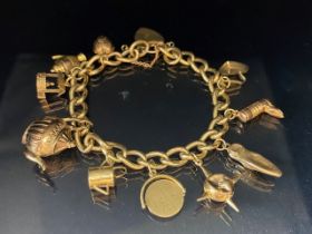 9ct Gold Charm Bracelet with 9ct Gold heart shaped lock, every link of the chain is hallmarked and