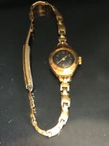 9ct Gold wristwatch by Rotary with Black face and Gold numerals and batons with rolled gold strap