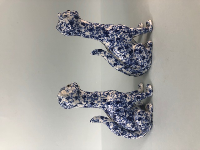 Oriental China, a pair of Chinese long neck cats with cobalt decoration of leaves and tendrils the - Image 2 of 5