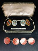 Cuff links, a pair of gold cased University of Aberystwyth enamel cuff links and a pair of silver