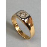 18ct Gold signet ring set with a single diamond in a star shaped setting size approx 'U' and total