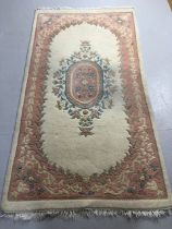 Modern Chinese style sculpted wool rug with flower design predominantly pink and cream approximately
