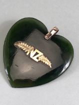 New Zealand Green stone Heart pendant early 20th century with gold metal inlay of NZ and silver