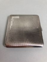Silver hall marked ladies cigarette case with gilded interior Art deco design, approximately 84.19g