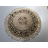 Modern Chinese Style round wool sculpted rug predominantly mushroom coloured back ground with