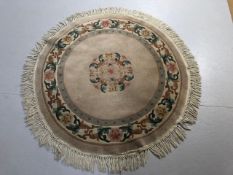 Modern Chinese Style round wool sculpted rug predominantly mushroom coloured back ground with