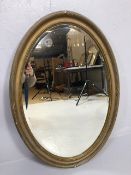 Wall mirror, Oval Bevel glass wall mirror in reeded regency style gilded plaster frame approximately