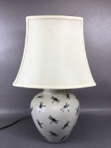 Modern table or side lamp, by India Jane the base of oatmeal crackle glaze with dragon fly design in