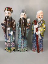 Antique Chinese ceramics, being a trio of large 19th century Famille Rose Immortals, Luk Sau Fuk.