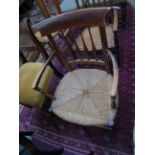Oak framed low armchair with reeded seat