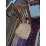 Oak cane seated hall chair with 4 vertical splats to the high back
