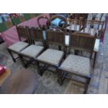 Set of 4 shaped backed dining chairs each with loose padded seat upholstered in patterned