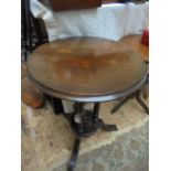 Larger circular topped dark oak side table,