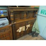 Heavy oak carved court cupboard, the upper portion inset 2 storage cupboards,