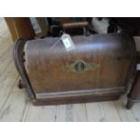 Singer sewing machine in damaged domed case